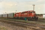 Vehicle train eases west through the yard